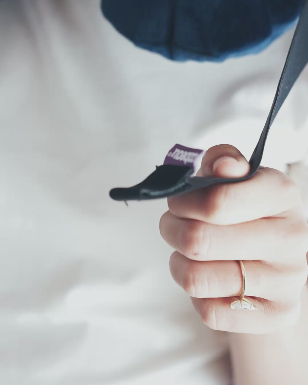 Feed chin strap through buckle, pull across pillow and secure to other side, resting chin comfortably on the strap